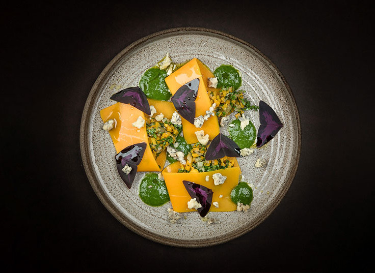 Open pumpkin ravioli with Achelse blue crumble, parsley sauce and Yka leaves