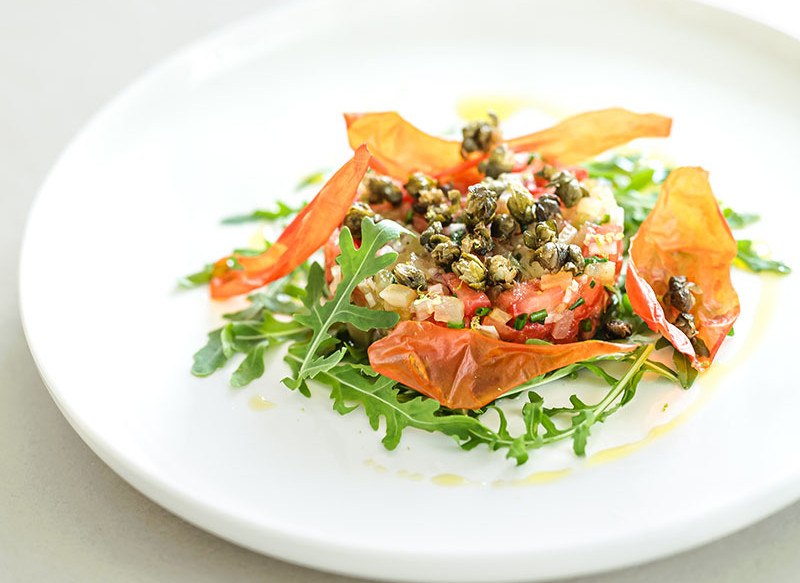 Yacon tartare with tomato, shallot & lime, served with capers, chives & rocket
