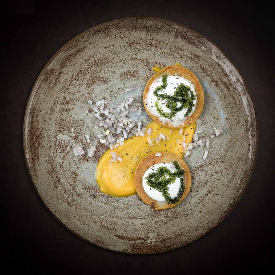 Pumpkin blinis with fresh cheese moai caviar